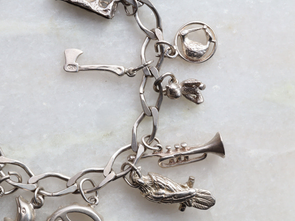 Sterling Silver Charm Bracelet With 15 Charms
